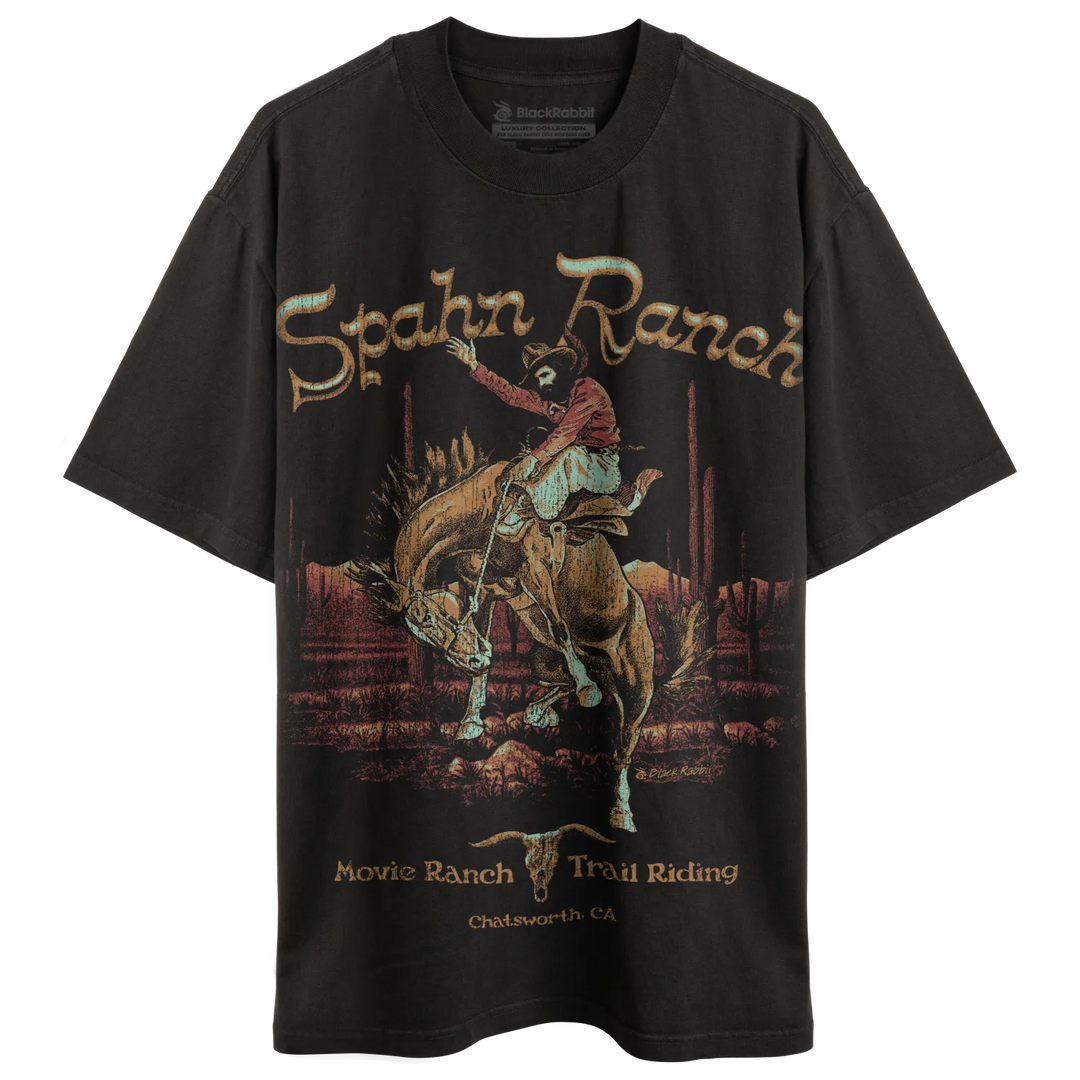 Black graphic t-shirt with a cowboy riding a bucking horse.