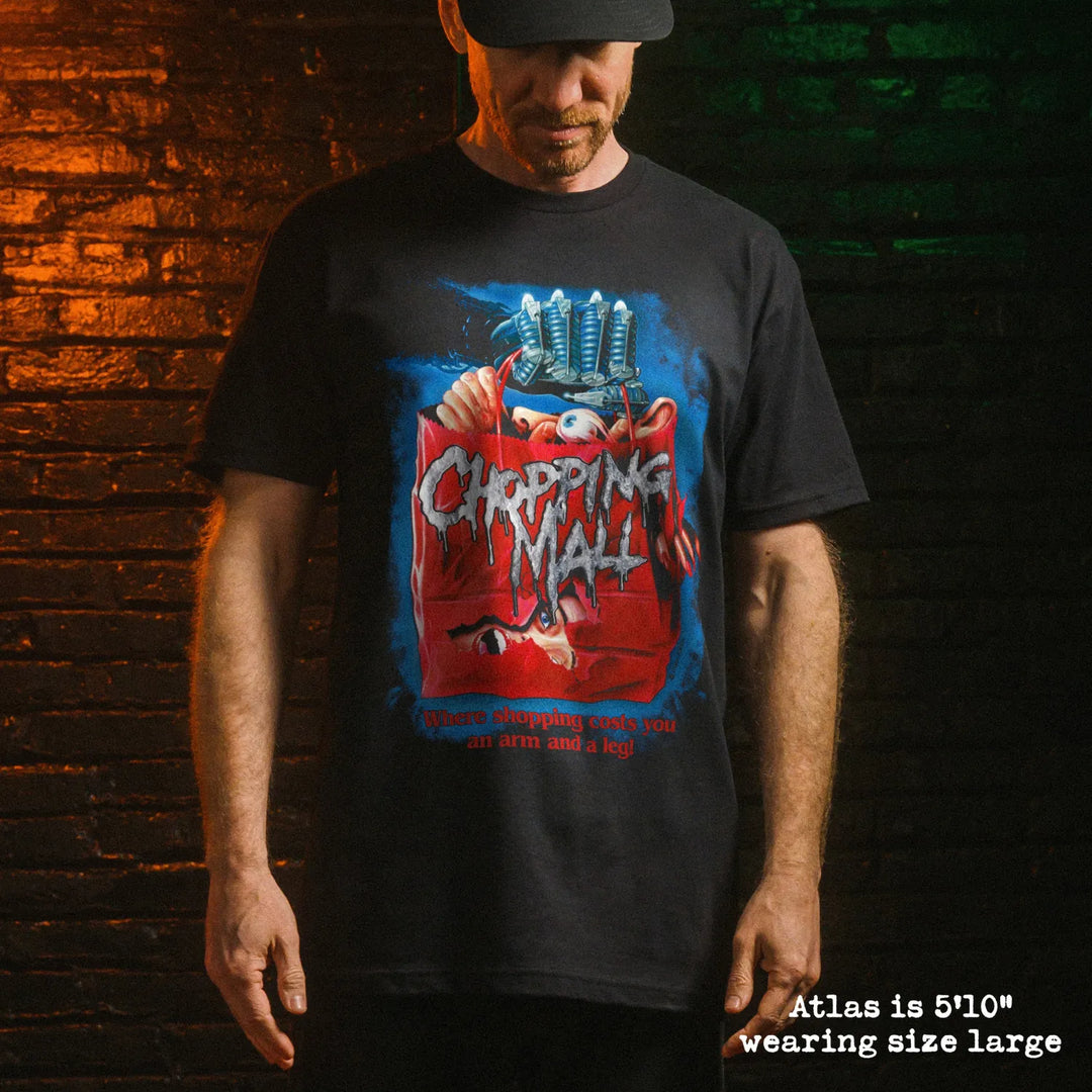 Male model wearing black premium tee with chopping mall graphic 