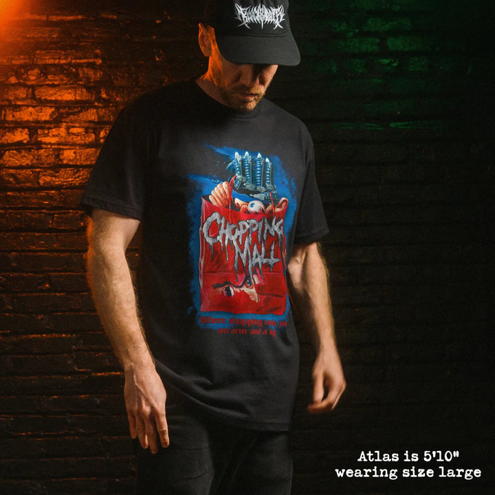 Male model wearing black premium tee with chopping mall graphic 
