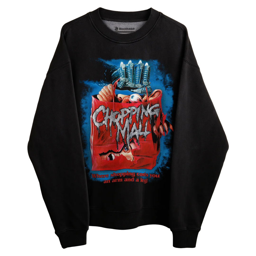 Black crewneck sweatshirt with ’chopping mall’ movie poster design, featuring a clawed hand and horror elements.