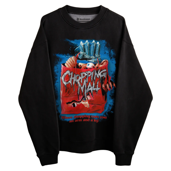 Black crewneck sweatshirt with ’chopping mall’ movie poster design, featuring a clawed hand and horror elements.