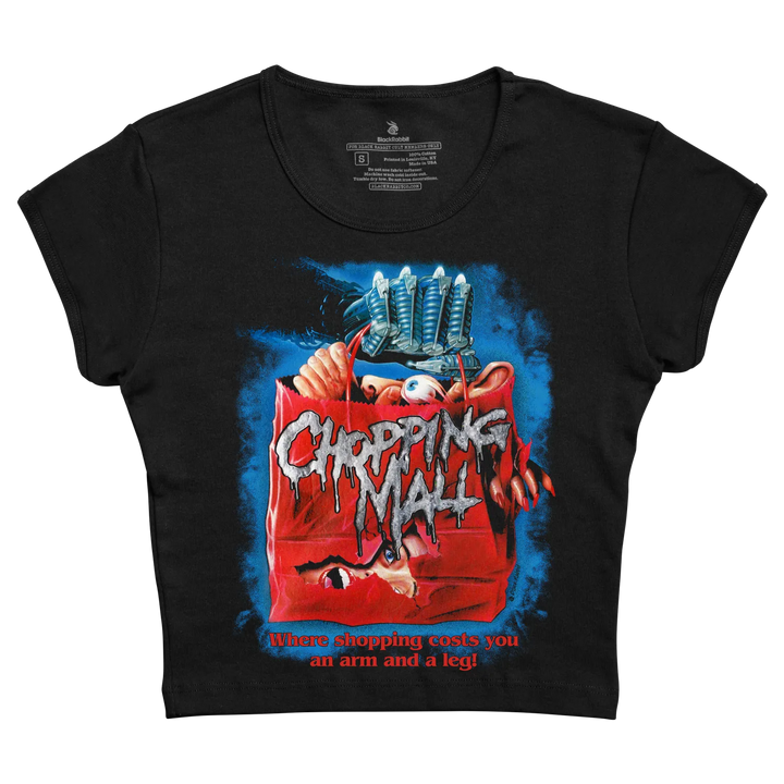 Black cropped t-shirt featuring a graphic of the ’chopping mall’ movie poster with a red shopping bag, blue background, and white dripping text. 