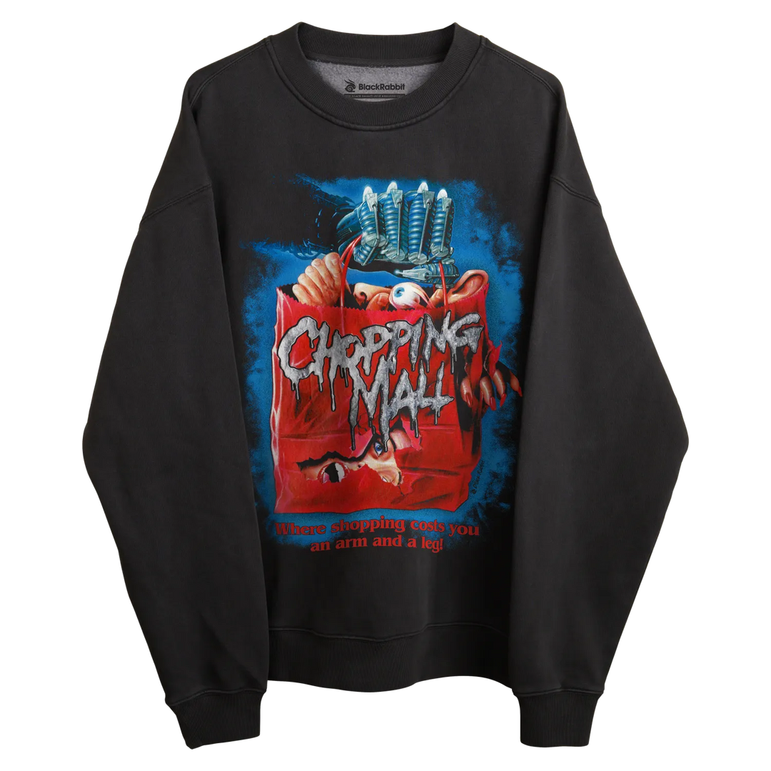 Black crewneck sweatshirt with ’chopping mall’ movie poster design, featuring a red trash can and blue background.