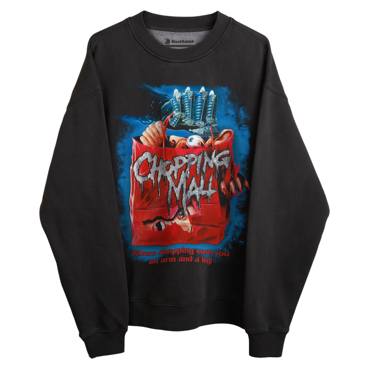 Black crewneck sweatshirt with ’chopping mall’ movie poster design, featuring a red trash can and blue background.