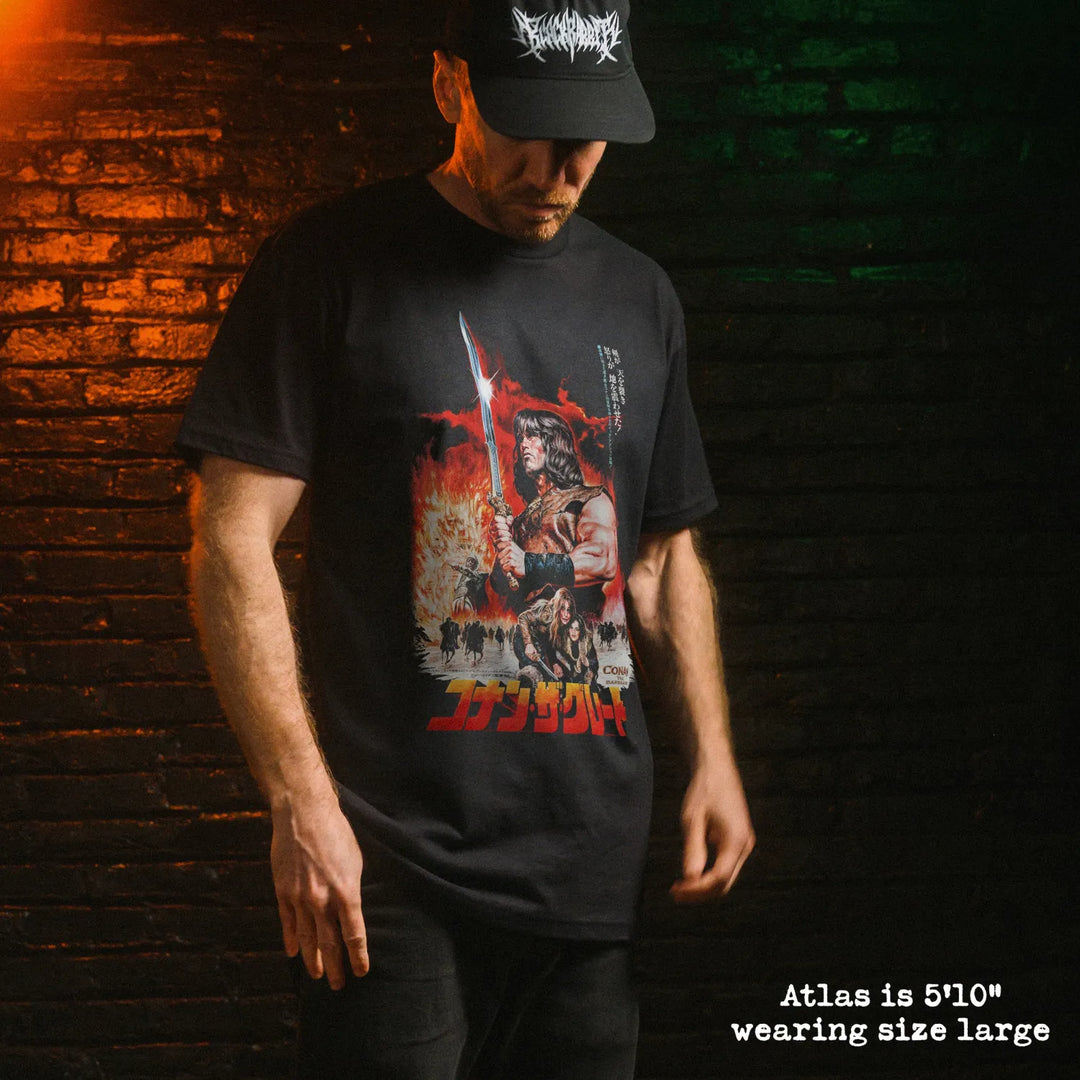 Male model wearing black premium tee with conan japan graphic 