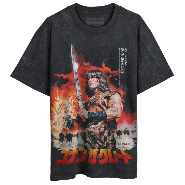 A dark gray, short-sleeved t-shirt featuring a vibrant graphic of Conan the Barbarian with a sword, against a fiery red background.