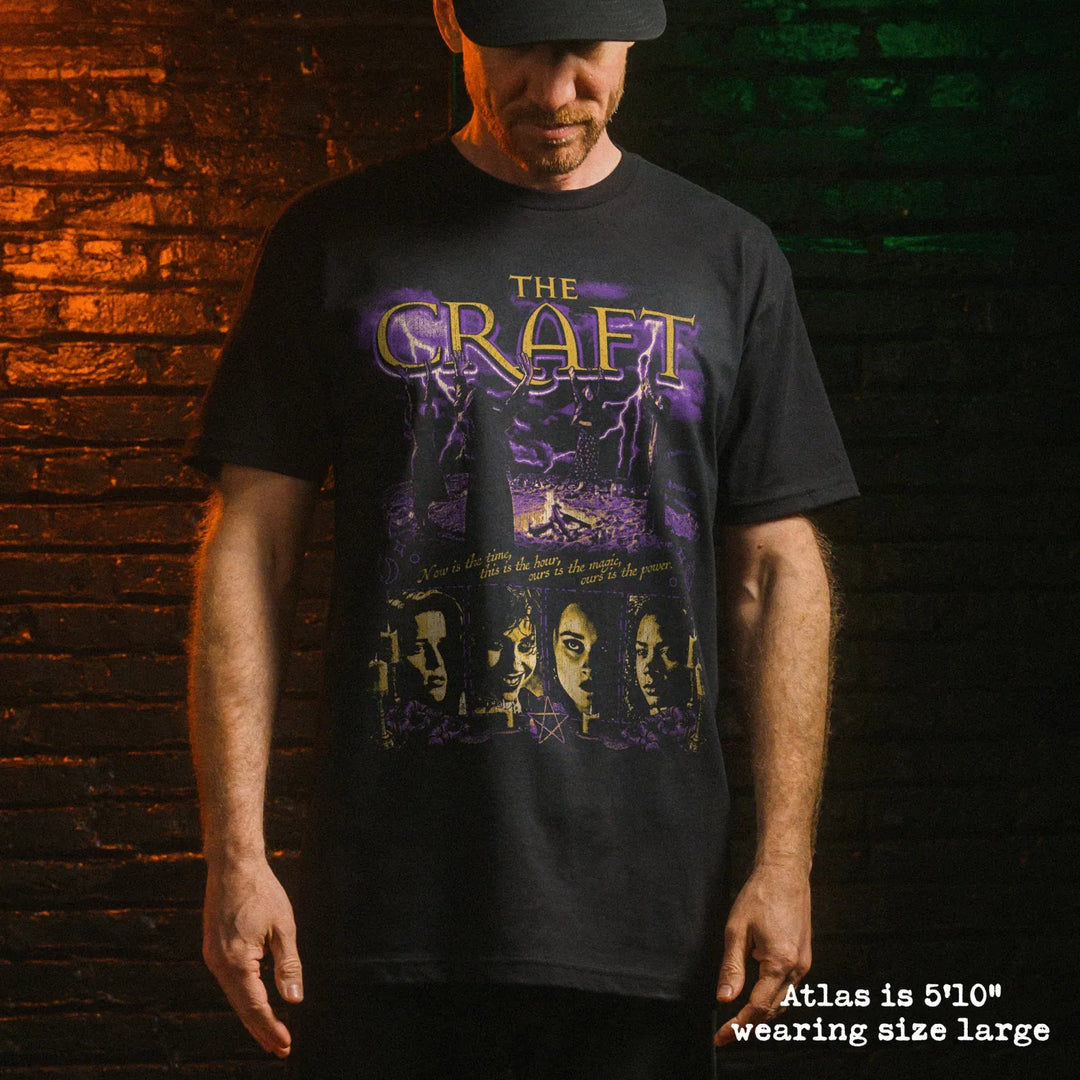 Male model wearing black premium tee with the craft graphic 