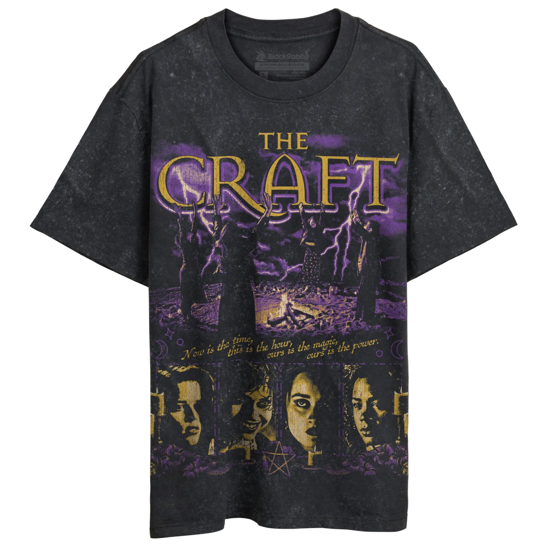 Dark grey t-shirt with a purple and gold graphic print of ’The Craft’ movie poster.