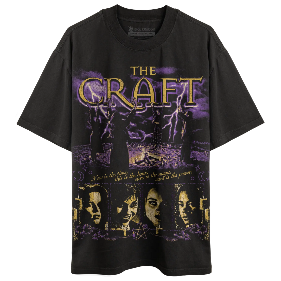 Black graphic t-shirt with a purple and gold ’The Craft’ design.