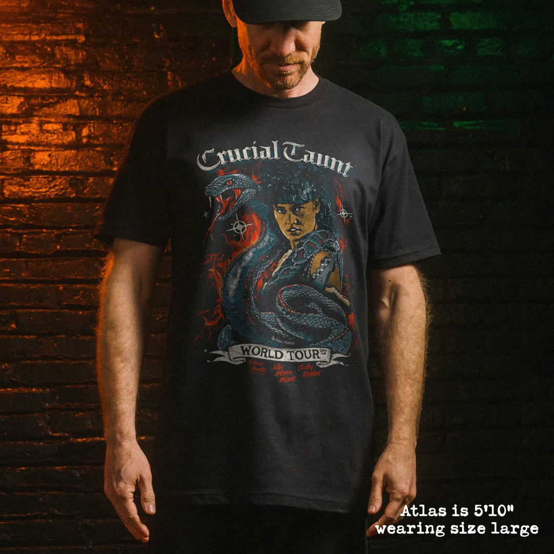 Male model wearing black premium tee with crucial taunt graphic 