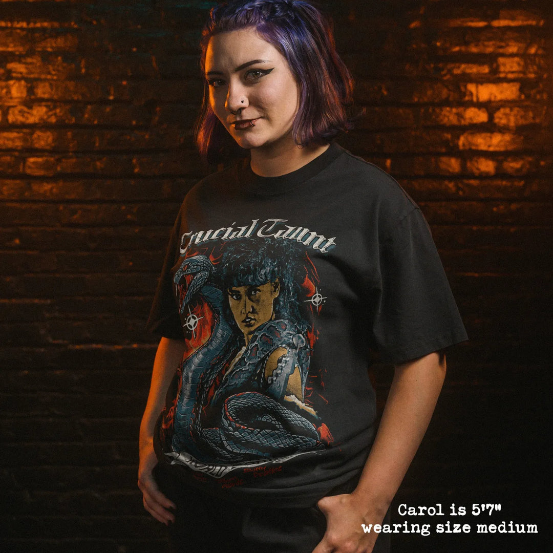 Model wearing heavy tee with crucial taunt graphic 