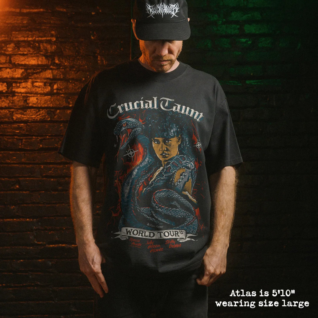 Model wearing heavy tee with crucial taunt graphic 
