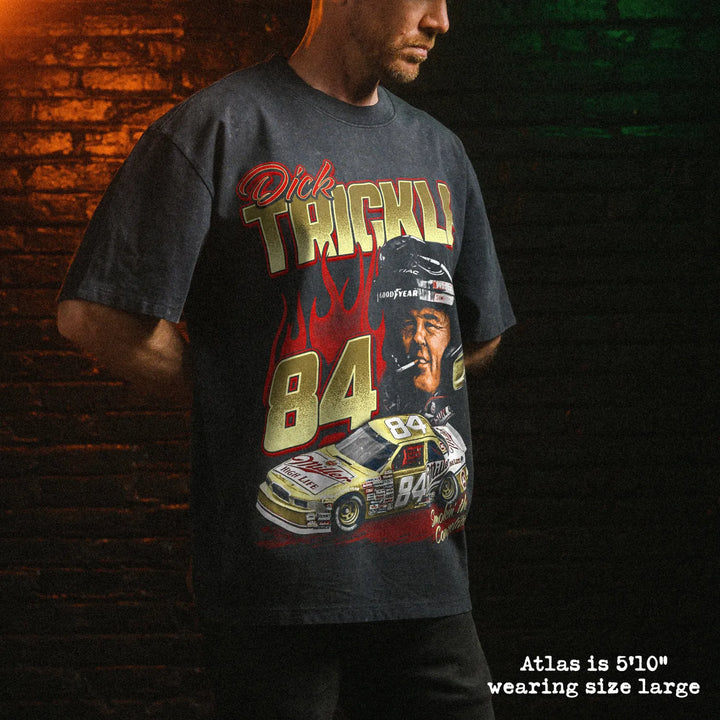 Male model wearing stone wash heavy tee with dick trickle graphic 