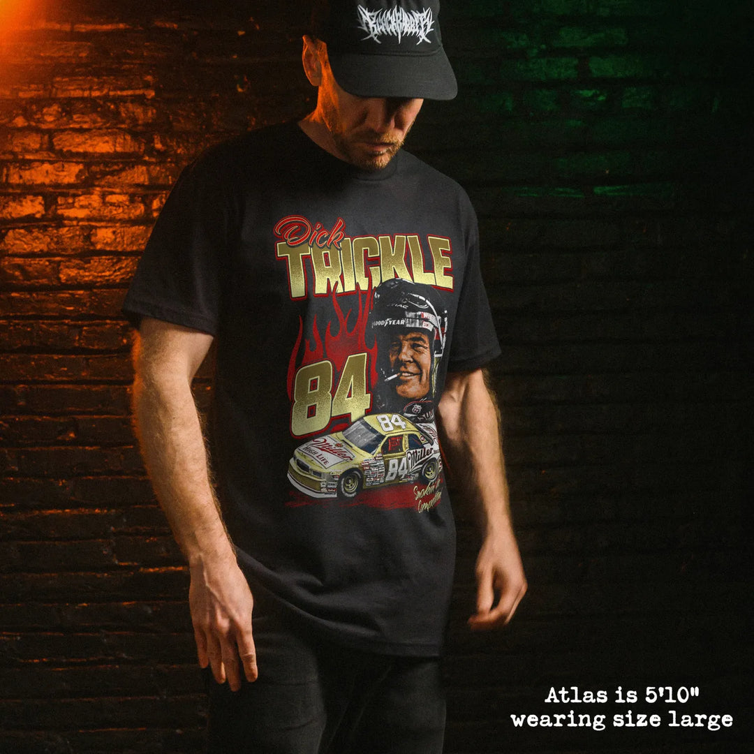 Male model wearing black premium tee with dick trickle graphic 