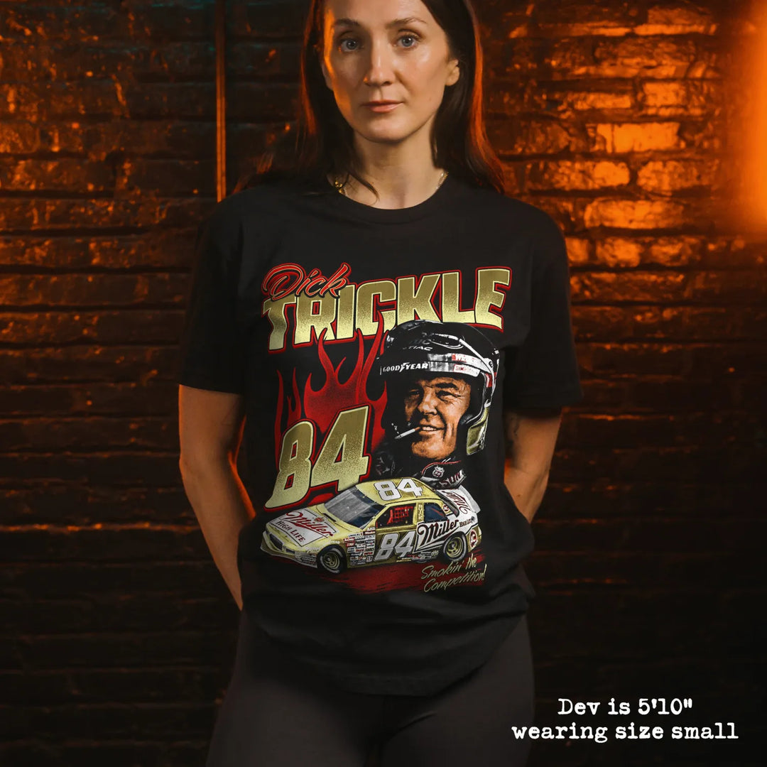 Model wearing black premium tee with dick trickle graphic 