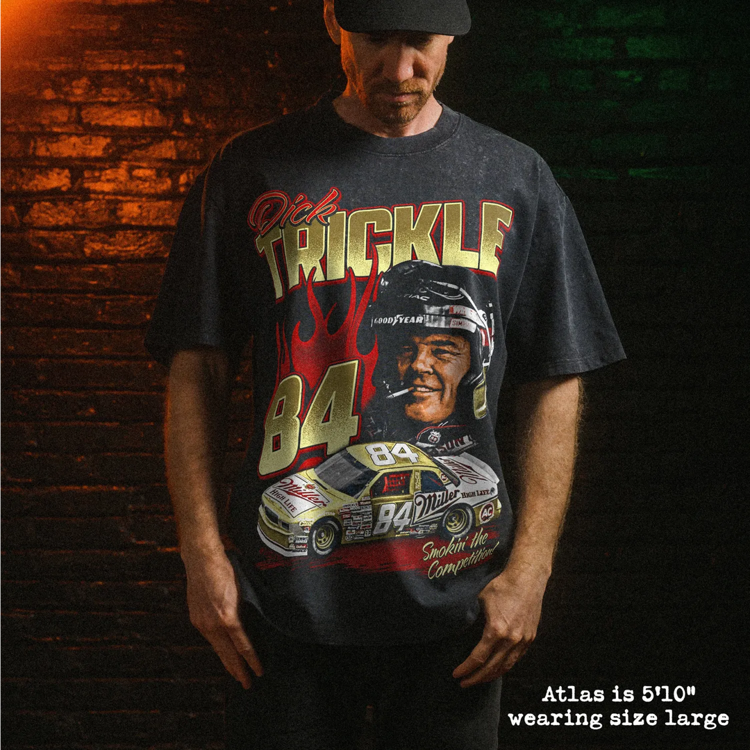 Male model wearing stone wash heavy tee with dick trickle graphic 