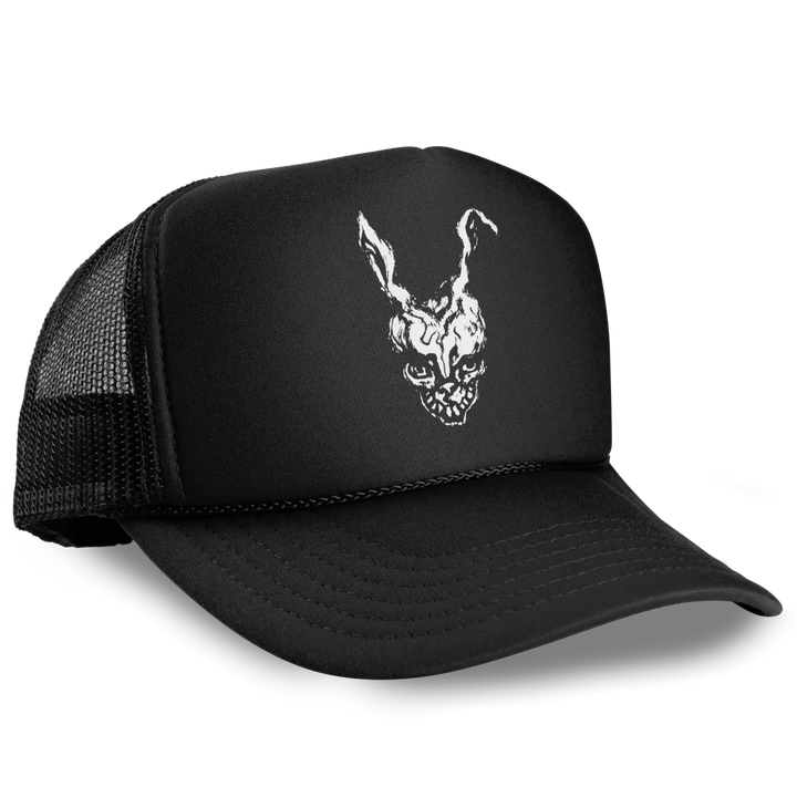 A classic foam-front black trucker hat with a white graphic of Frank from Donnie Darko 