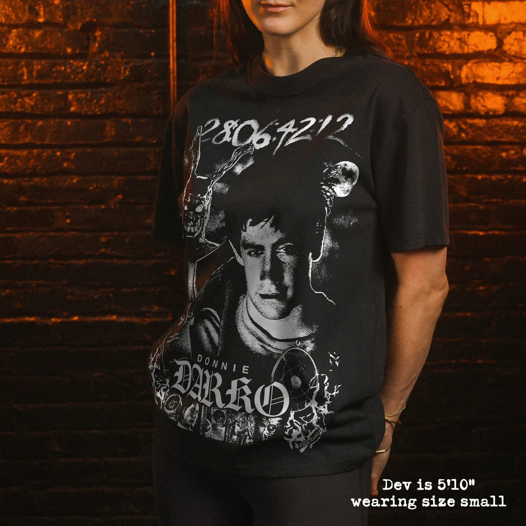 Model wearing heavy tee with Donnie Darko graphic 