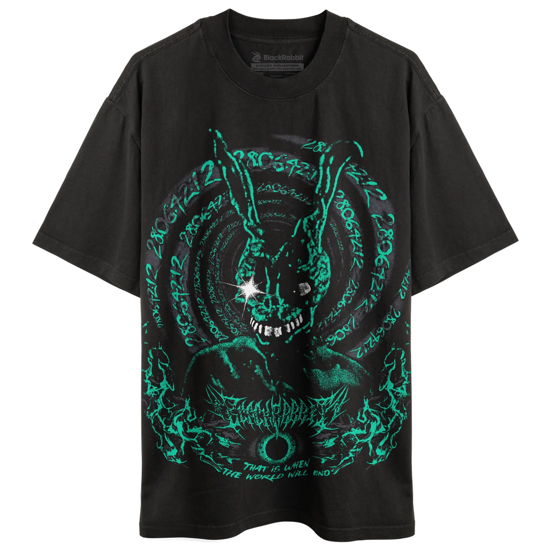 A black short-sleeve graphic t-shirt featuring a glowing neon green circular rabbit design with occult-style text and a starburst detail on the chest. 