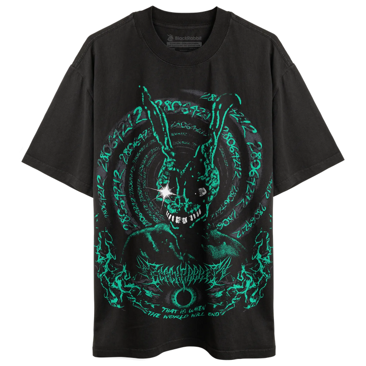 A black short-sleeve graphic t-shirt featuring a glowing neon green circular rabbit design with occult-style text and a starburst detail on the chest. 