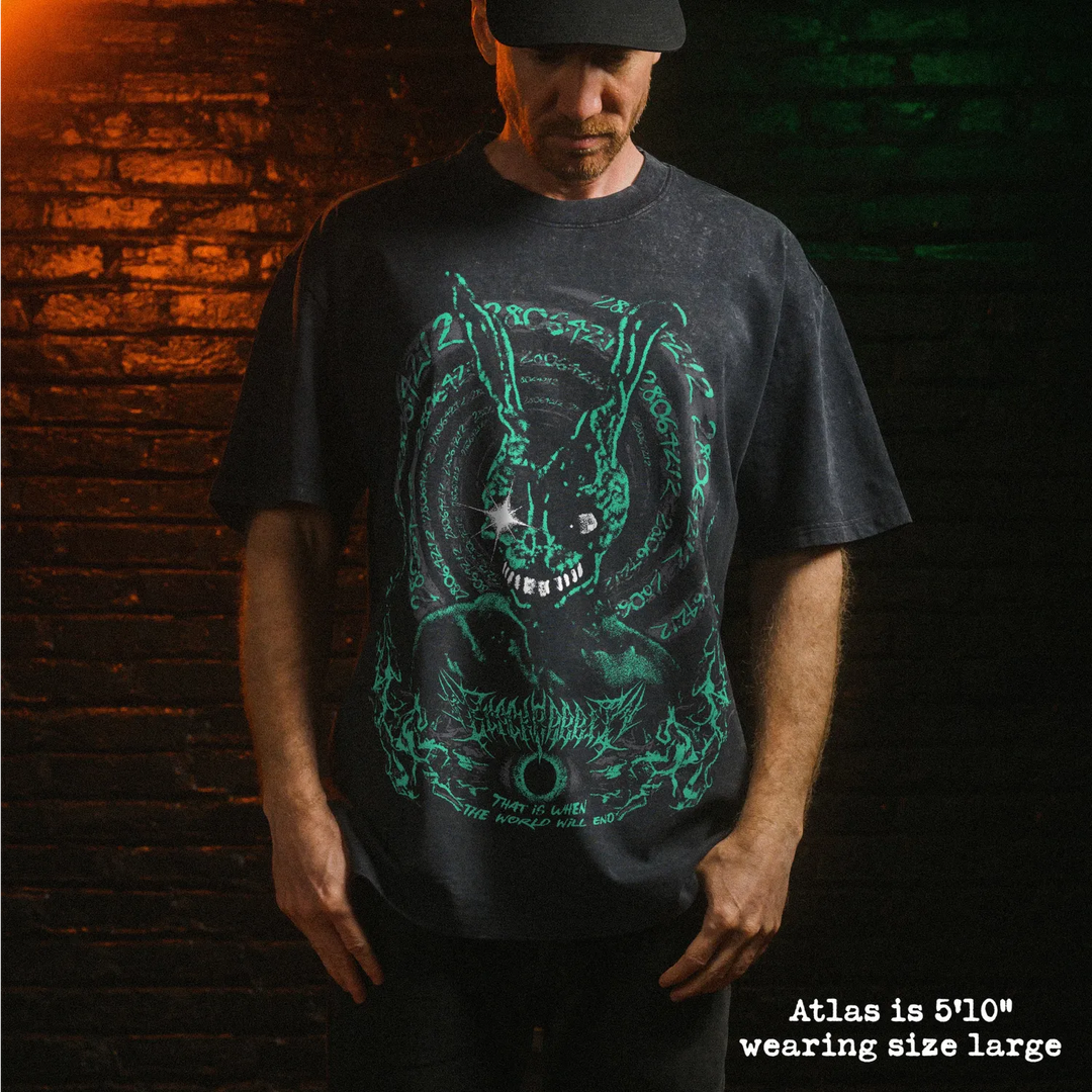Male model wearing heavy stone wash tee with Donnie Darko graphic. 