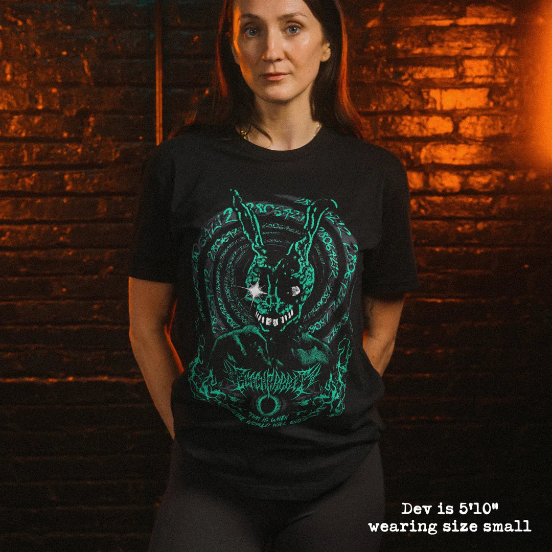 Female model wearing soft premium tee with Donnie Darko graphic
