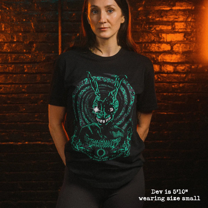 Female model wearing soft premium tee with Donnie Darko graphic
