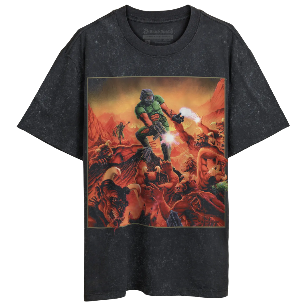 A dark gray t-shirt with a vibrant, action-packed illustration of a green-armored figure battling demons.
