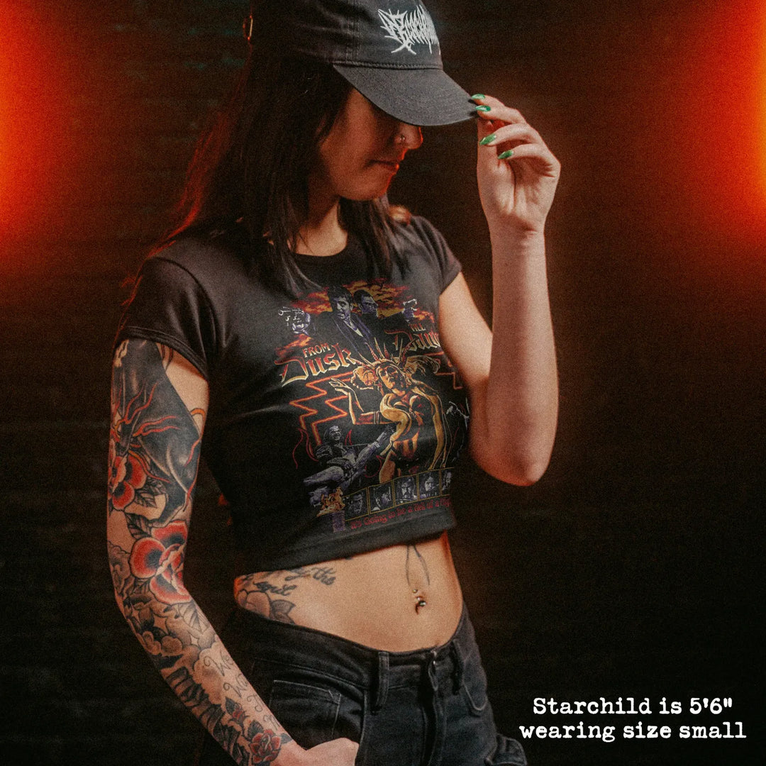 Female model wearing cropped baby tee with from dusk till dawn graphic
