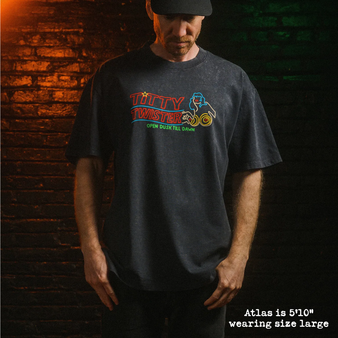 Model wearing stone washed heavy tee with Titty Twister graphic