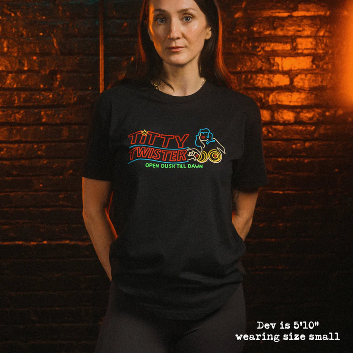 Female model wearing soft premium tee with Titty Twister graphic