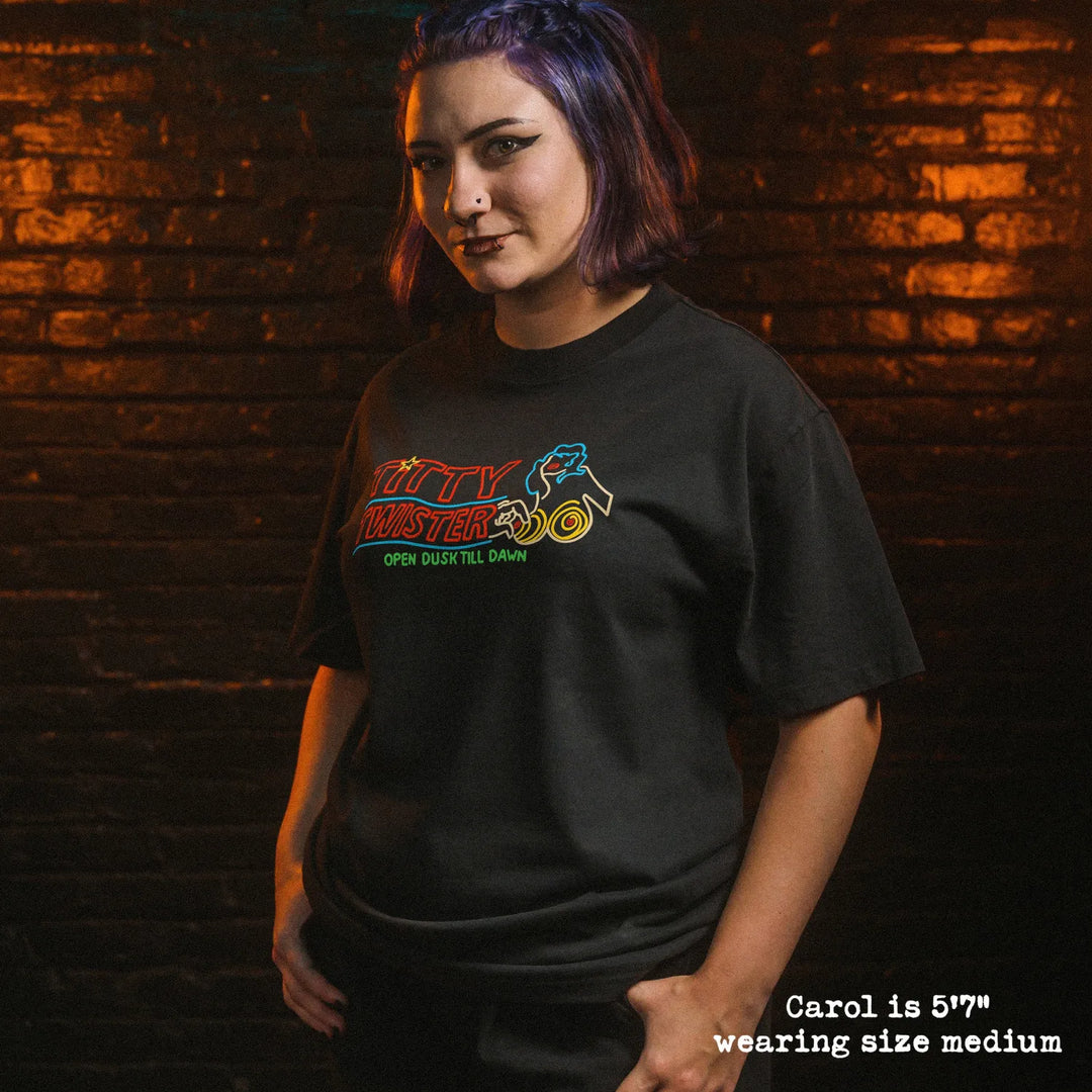 Female model wearing heavy tee with Titty Twister graphic