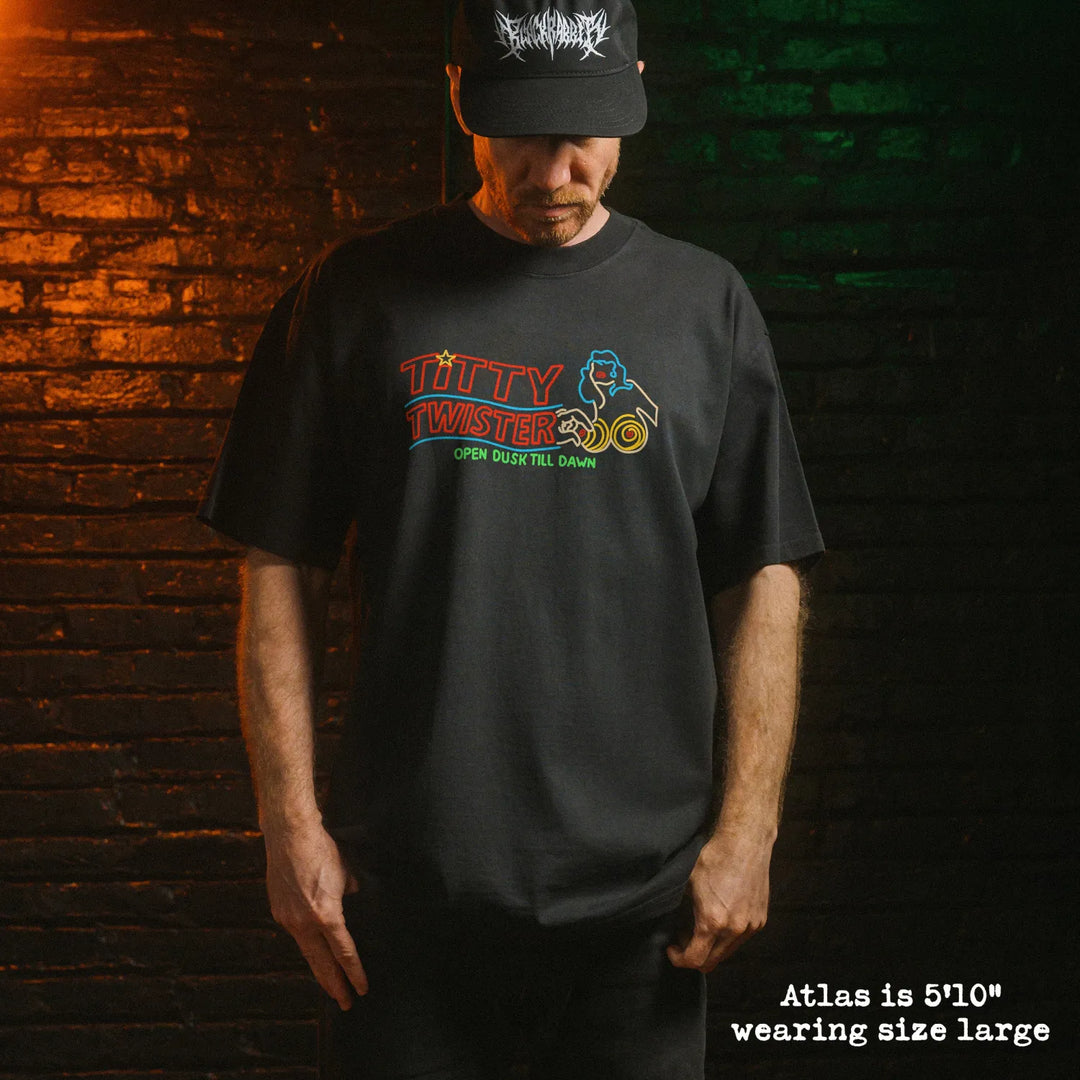 Male model wearing heavy tee with Titty Twister graphic