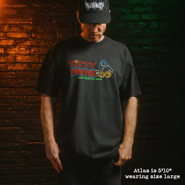 Male model wearing heavy tee with Titty Twister graphic
