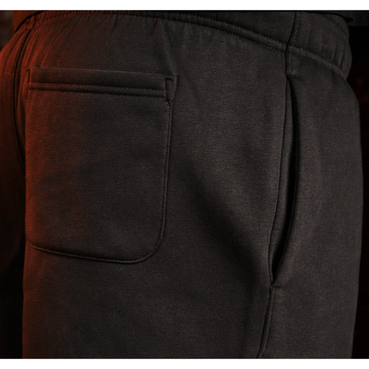 Charcoal gray sweatpants with pockets and elastic waistband