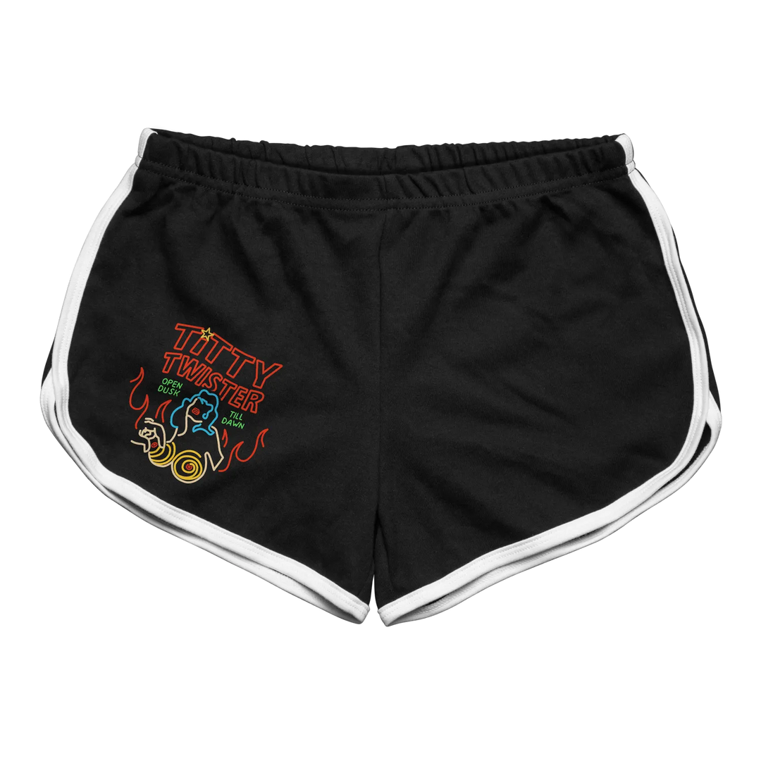 Black athletic shorts with white side stripes and a neon-style ’titty twister’ graphic on the left leg.