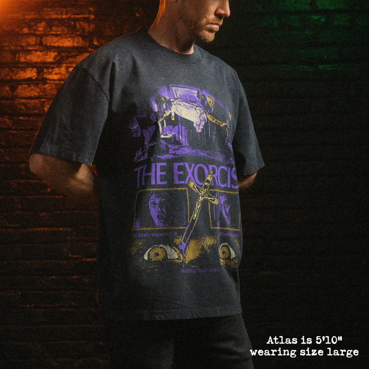 Male model wearing stone wash heavy tee with exorcist graphic 