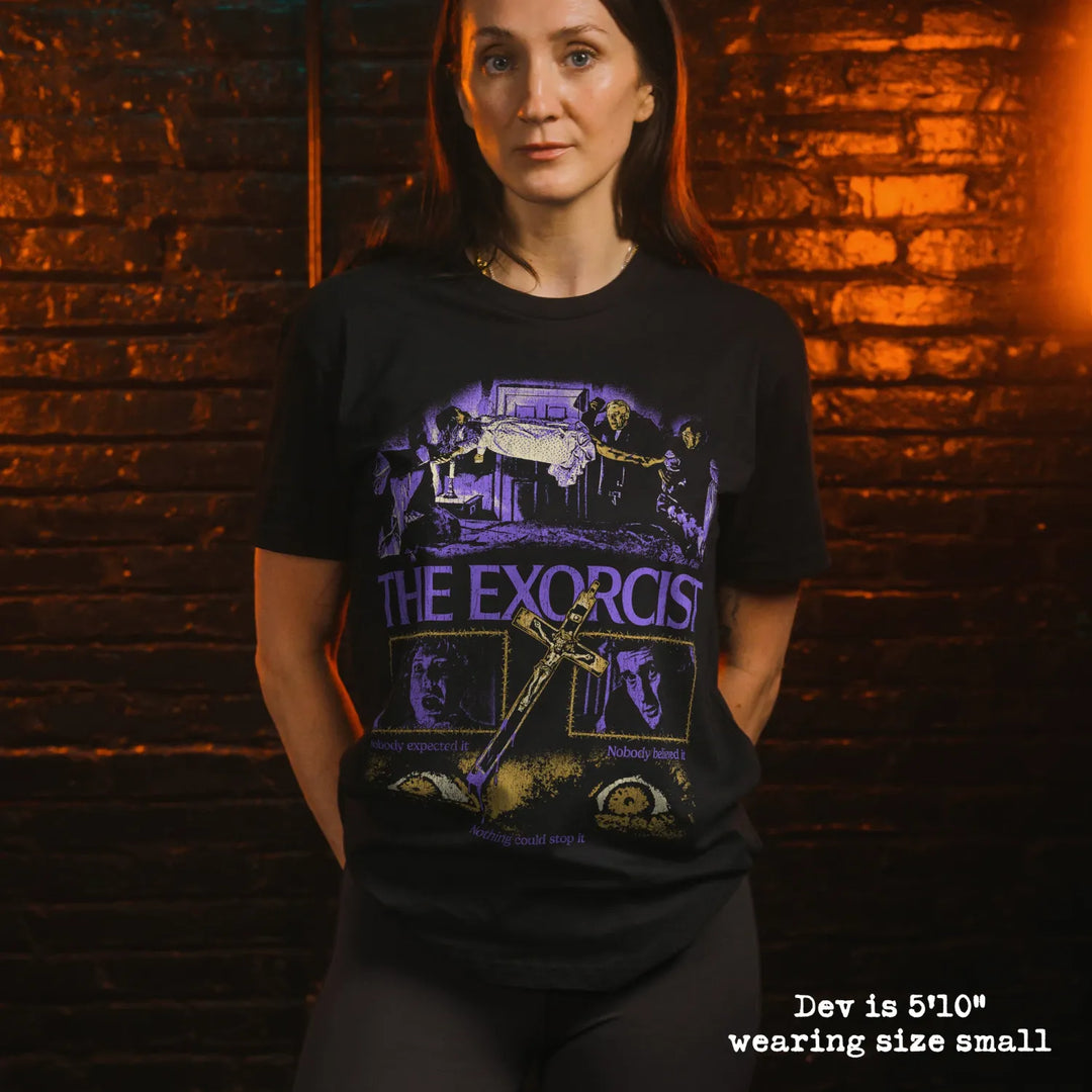 model wearing black premium tee with exorcist graphic 
