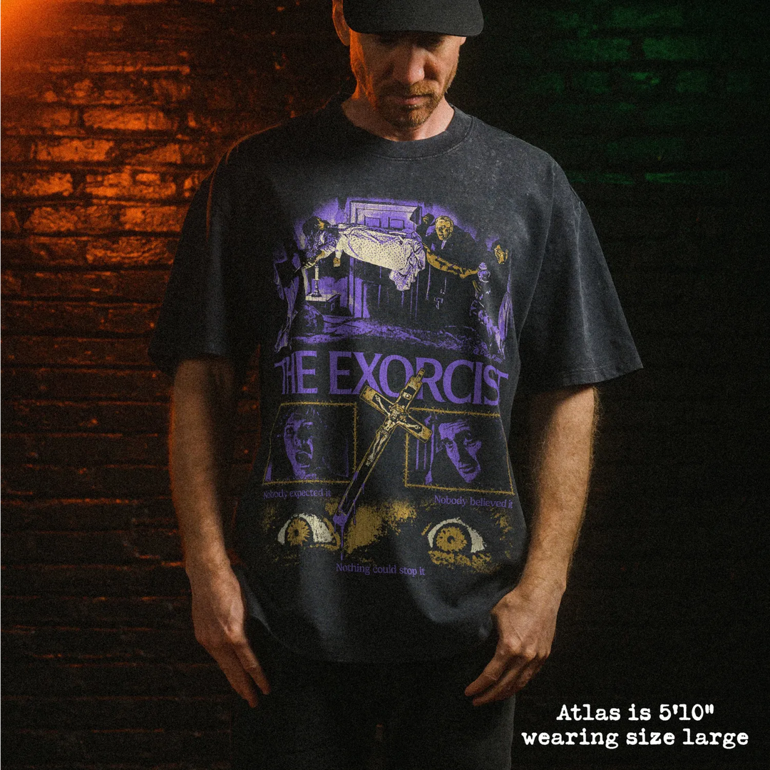 Male model wearing stone wash heavy tee with exorcist graphic 