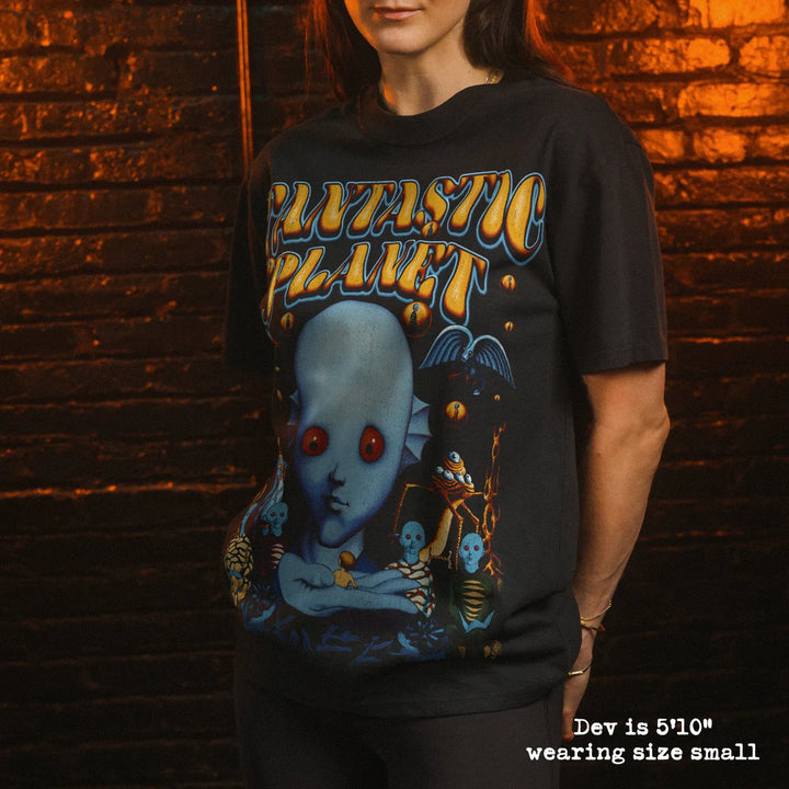 Model wearing heavy tee with Fantastic Planet graphic 