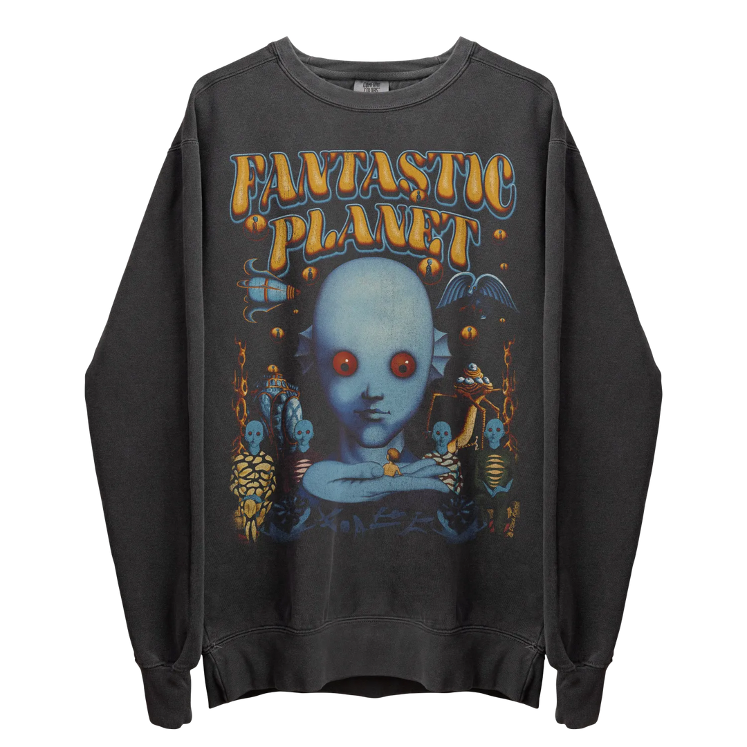 Dark grey crewneck sweatshirt with a colorful graphic print of a blue-skinned, red-eyed alien and other fantastical figures.