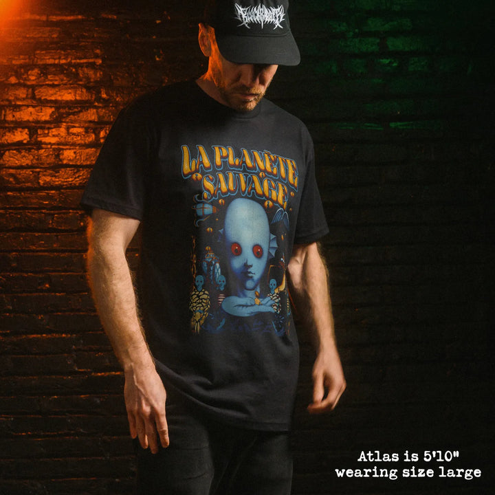 Male model wearing black premium tee with fantastic planet french graphic 