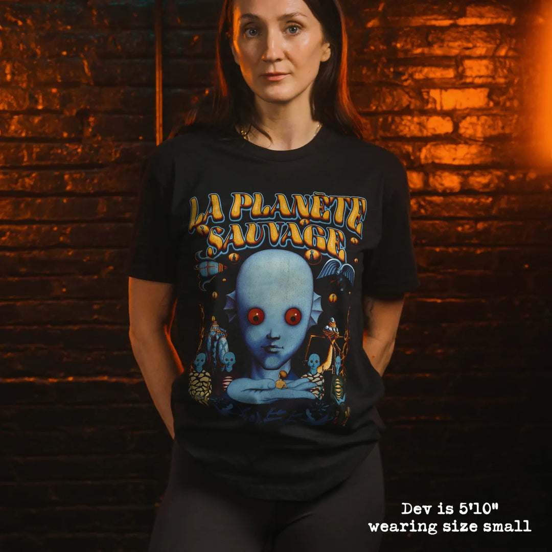 model wearing black premium tee with fantastic planet graphic 