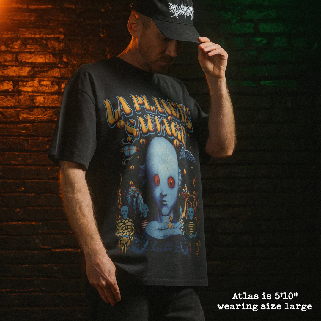 Model wearing heavy tee with fantastic planet graphic 