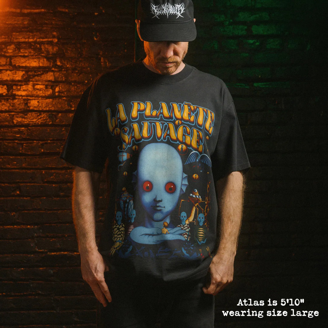 Model wearing heavy tee with fantastic planet french graphic 