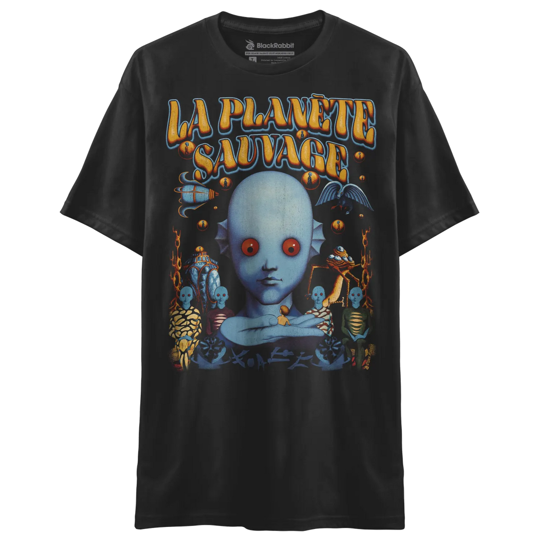 Black t-shirt with a colorful graphic print of a blue-skinned, red-eyed humanoid creature surrounded by other fantastical beings and the words ’LA PLANÈTE SAUVAGE’.