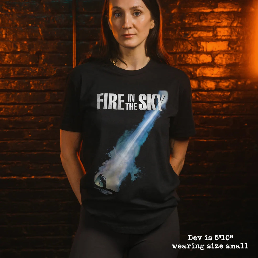model wearing black premium tee with fire in the sky graphic 