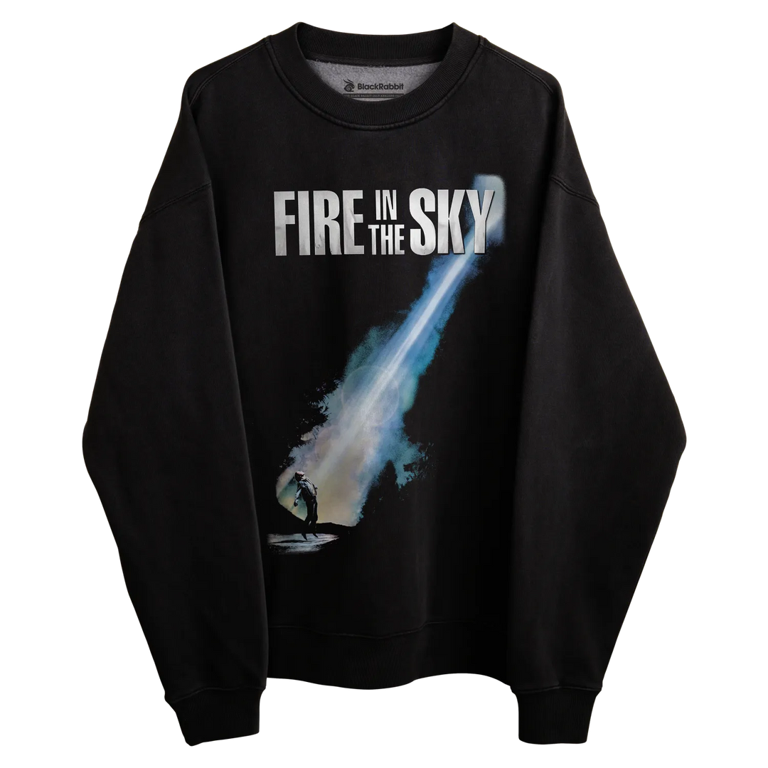 Black long-sleeved sweatshirt with ’fire in the sky’ graphic and comet design, inspired by 1982 film.