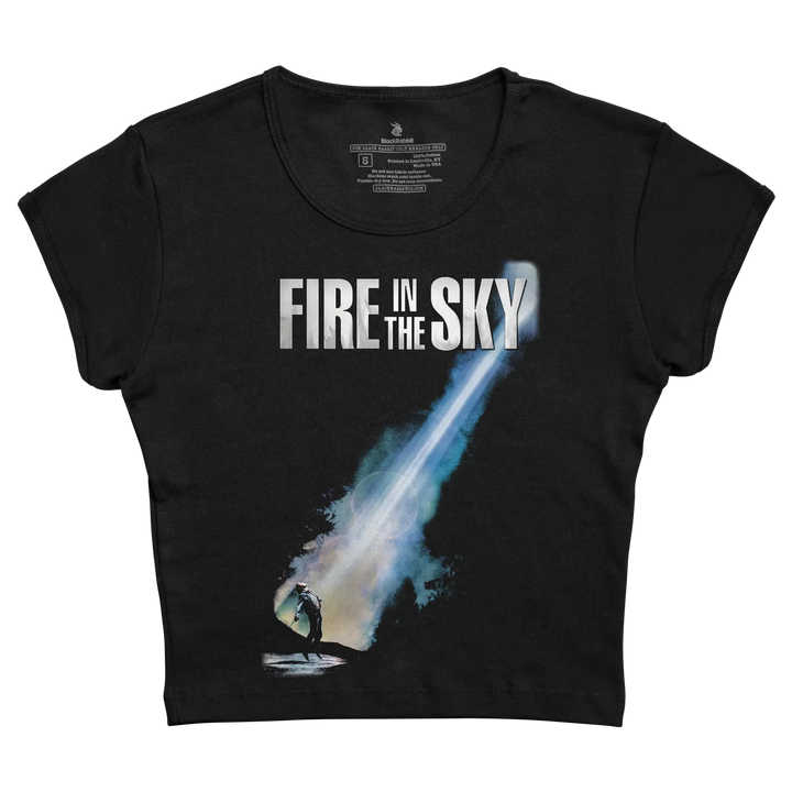 Black cropped t-shirt featuring a graphic of ’fire in the sky’ with a glowing blue beam and silhouette, printed in white.