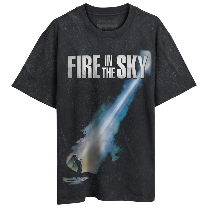 Dark grey t-shirt with a blue and white graphic of a streaking object and the text ’FIRE IN THE SKY’.